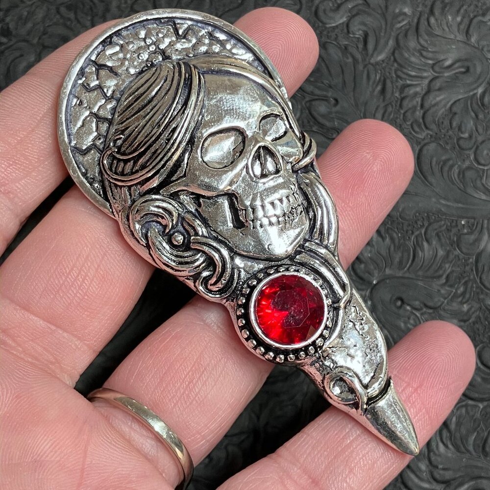 Santa Muerte Skull Pendant With a Faceted Create Garnet